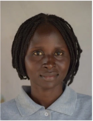 A student smiling after graduating from ECU